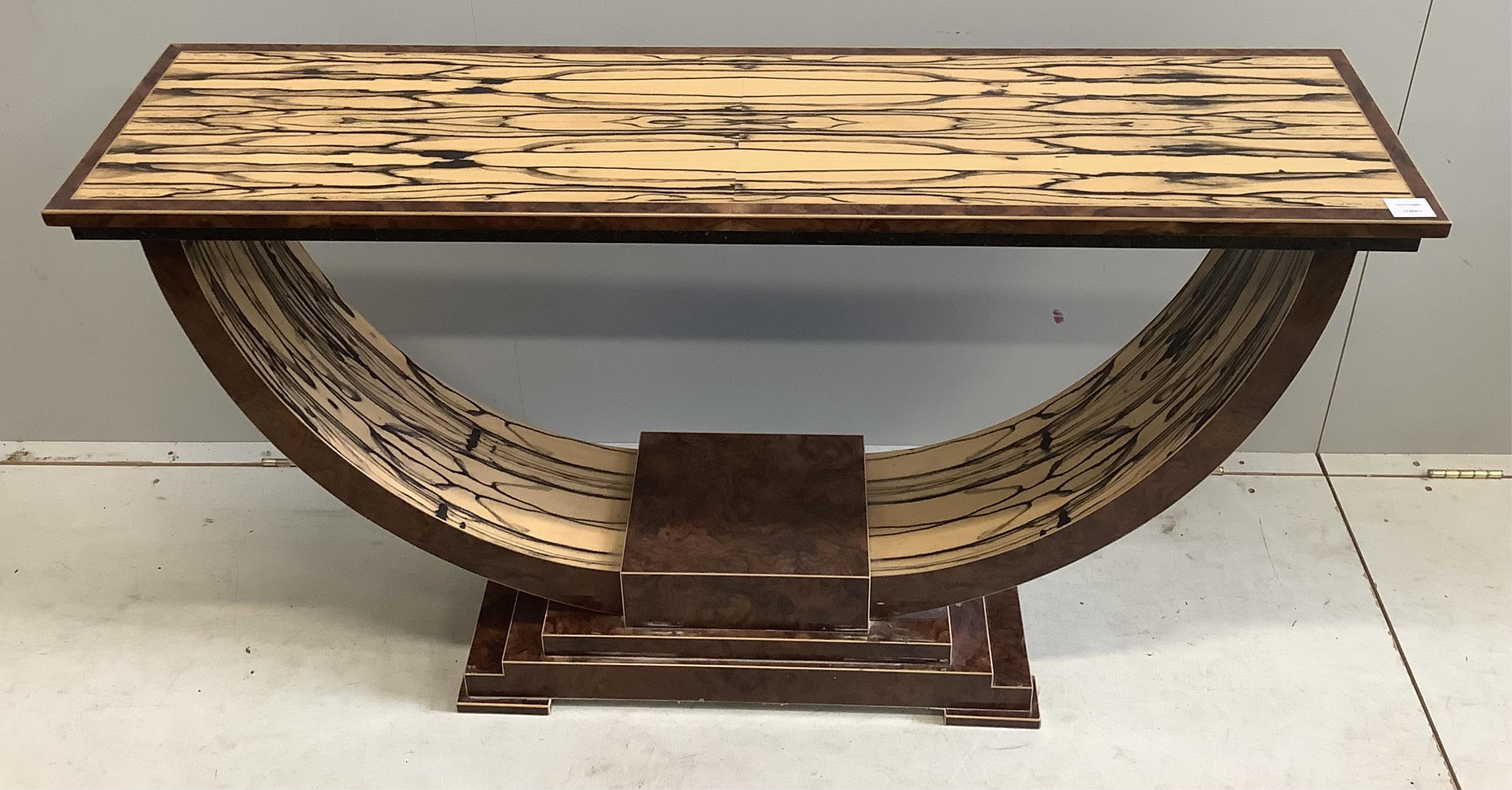 An Art Deco style white ebony and walnut console table